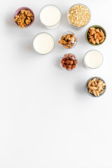 Above view of non-dairy milk alternative - almond hazelnut walnut oat milk