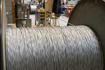 Fototapeta premium A coil of power electric cable in yellow insulation on a metal coil