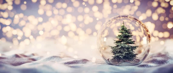 Deurstickers Christmas tree in glass ball on snow. Glitter lights © Photocreo Bednarek