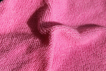 Naklejka na ściany i meble Pink microfiber napkin. Red cloth for the kitchen.