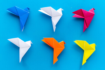 Paper birds of different shades. Origami concept. Top view