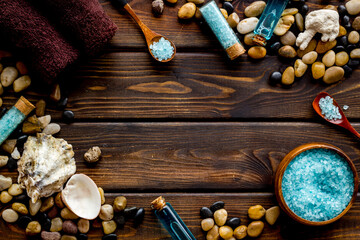 Obraz na płótnie Canvas Frame of wellness set of spa cosmetics with sea salt and stones