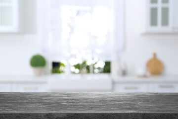 Textured table in light kitchen. Space for design