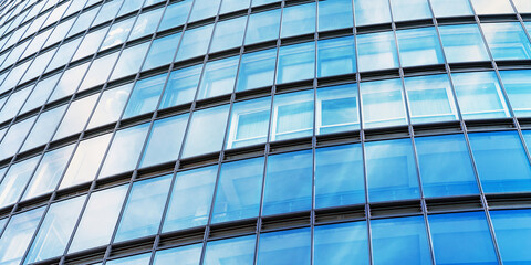 Fototapeta premium background of modern office building wall with glass windows