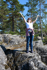 Woman on stone island in Ladoga skerries