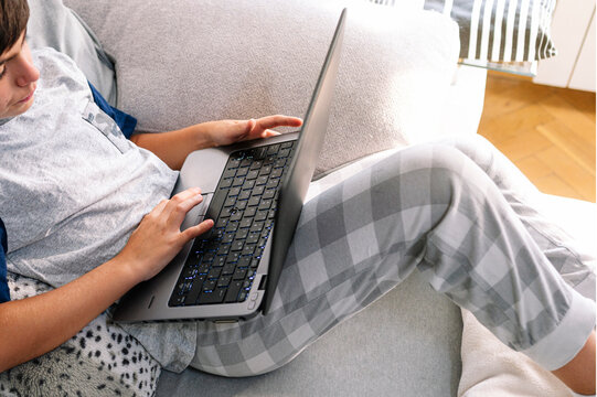 11 Year Old Boy With Laptop At Home