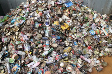 used metal can for solid waste processing