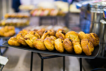 croissants and other sweets on the buffet table during the coffee break