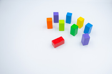 Untidy variety colorful blocks see sleep red block at white background