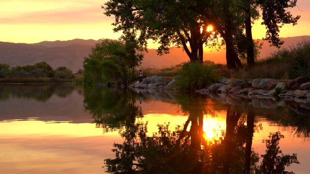 Reflection of sunset over lake surface during wildfires of late August 2020 in Colorado