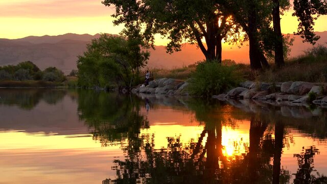Reflection of sunset over lake surface during wildfires of late August 2020 in Colorado