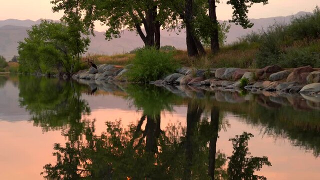 Reflection of sunset over lake surface during wildfires of late August 2020 in Colorado