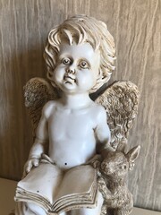 statue of angel with a cross
