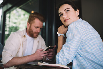 Woman sitting in cafe with colleague