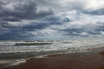 Skateboarding on a rough sea day in summer