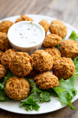 Homemade falafel with yogurt sauce close up