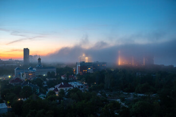 View of residential buildings at the sunset with cloudy sky.