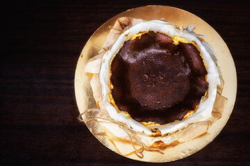 Basque burnt cheesecake on wooden table