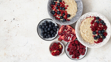 Oatmeal Porridge with berries and pomegranate.Healthy Breakfast
