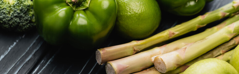 fresh green ripe fruits and vegetables on wooden surface, panoramic shot