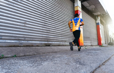 a person in athlete clothes running doing exercise on the street, lifestyle and good physical health concept.
