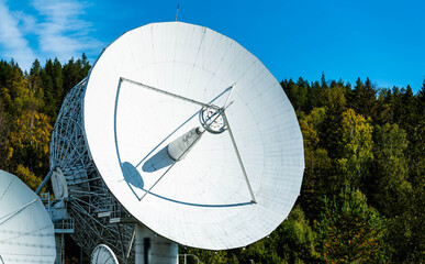 Huge white radar antenna for satellite communication and astronomical observations. 