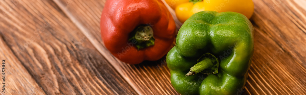 Canvas Prints colorful ripe bell peppers on wooden table, panoramic shot