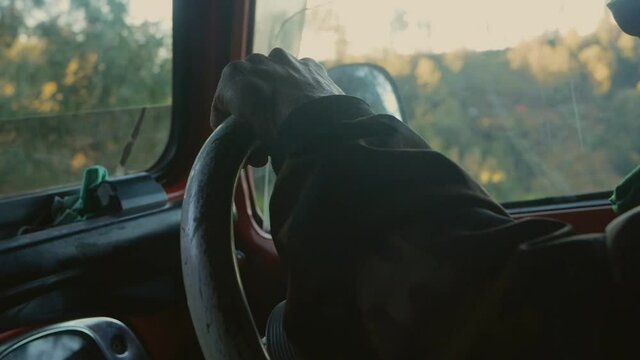 This Steering wheel view from a man is taken from antique 4x4 adventure car at Bromo, East Java, Indonesia. this footage is taken with mirrorless camera with Handheld Camera movement