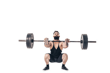 The technique of doing an exercise of deadlift with a barbell of a muscular strong tattooed bearded...