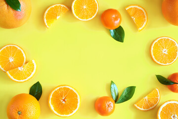 Slices, whole citruses are scattered around on background. Tangerines, oranges, grapefruits are...