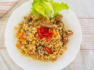 plate with pilaf, hot pepper and herbs. national cuisine. Oriental food.