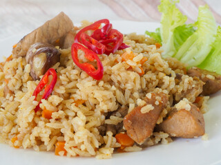 plate with pilaf, hot pepper and herbs. national cuisine. Oriental food.