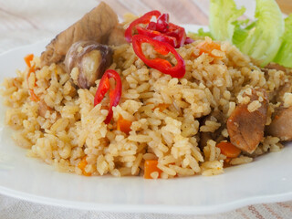 plate with pilaf, hot pepper and herbs. national cuisine. Oriental food.