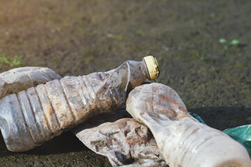 spilled used plastic bottles on the ground, waste, earth, ocean pollution, waste problem, copy space.