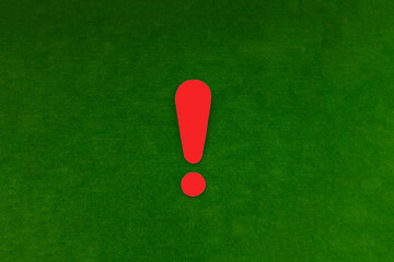 Red exclamation mark on a green background. Warning, attracting attention.
