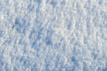 Snow texture in sunny weather, winter background