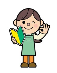 Fototapeta premium 初心者マークを持ったエプロン姿の女性