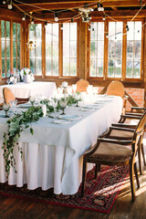 Festive table setting for birthday or wedding in style of rustic, boho. Decor in natural colors. Selective focus. Vertical images.