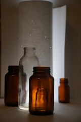 Composition of the five cans in front of a white wall