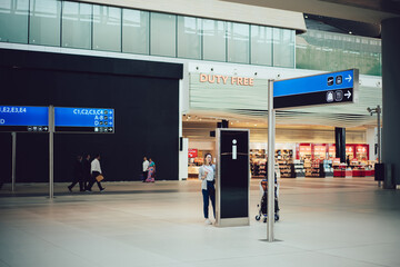 Anonymous woman waiting for departure in terminal
