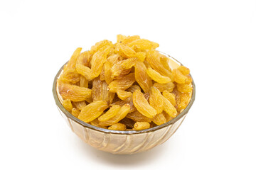 Bowl full of raisins on white background.