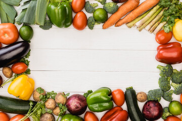 top view of fresh ripe vegetables and fruits on wooden white background © LIGHTFIELD STUDIOS