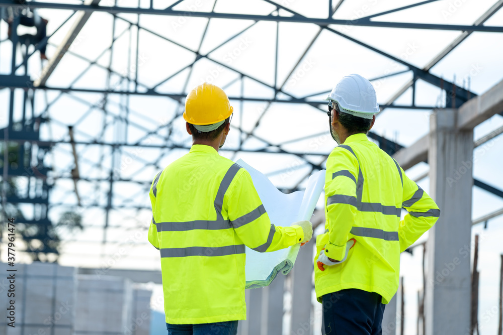 Aufkleber Engineer and architect discussing meeting with blueprint and ideas about building structure on construction site.