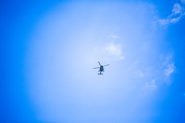 Naklejka na ściany i meble helicopter in the blue sky