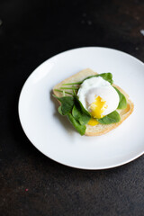 tasty poached egg sandwich
 spinach and other ingredients on the table serving portion size top view place copy space for text