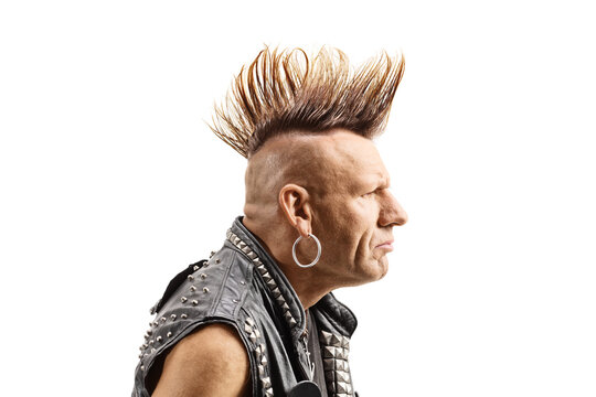 Profile shot of a middle aged punker with a mohawk