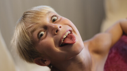 9 year old boy having fun and showing tongue at the camera © 22Imagesstudio