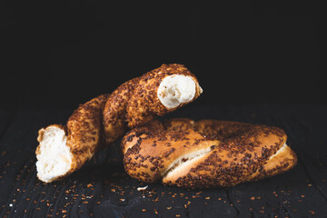 Bagel with sesame on black background