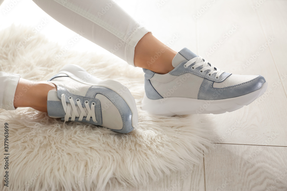 Poster Woman wearing comfortable stylish sneakers indoors, closeup