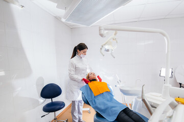 Fototapeta premium The dentist conducts an examination and consultation of the patient. Dentistry